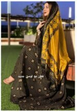 ثوب أسود اللون مصنوع من القطن بتصميم جميل مطبوع مع شيلة متناسقة مخيطة على الطراز الظفاري ومتوفر أيضًا بدون خياطة